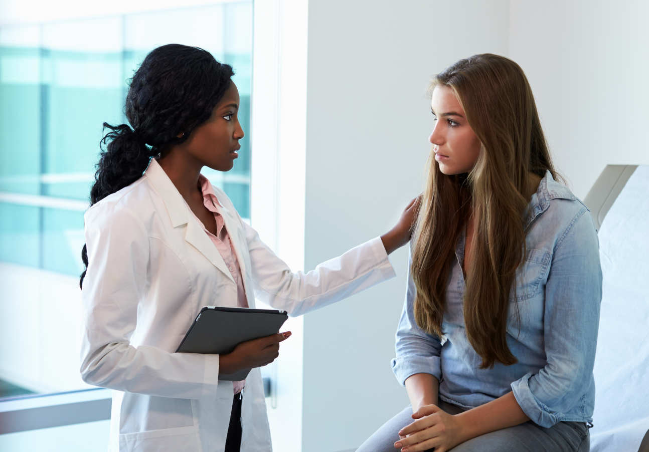 A doctor consults a patient