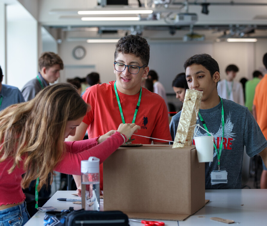 Students work on cardboard robot