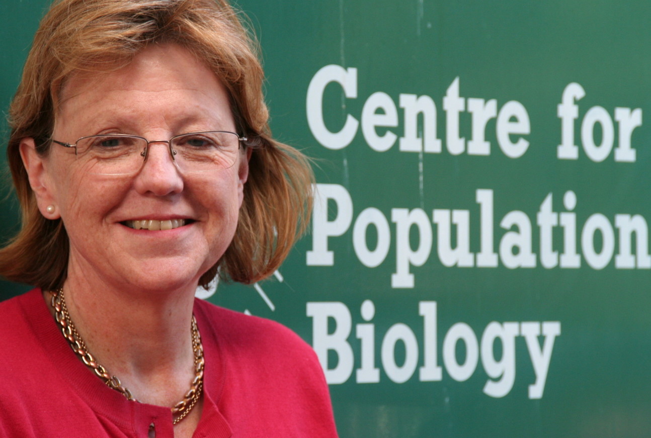 Georgina Mace next to a sign for the Centre for Population Biology