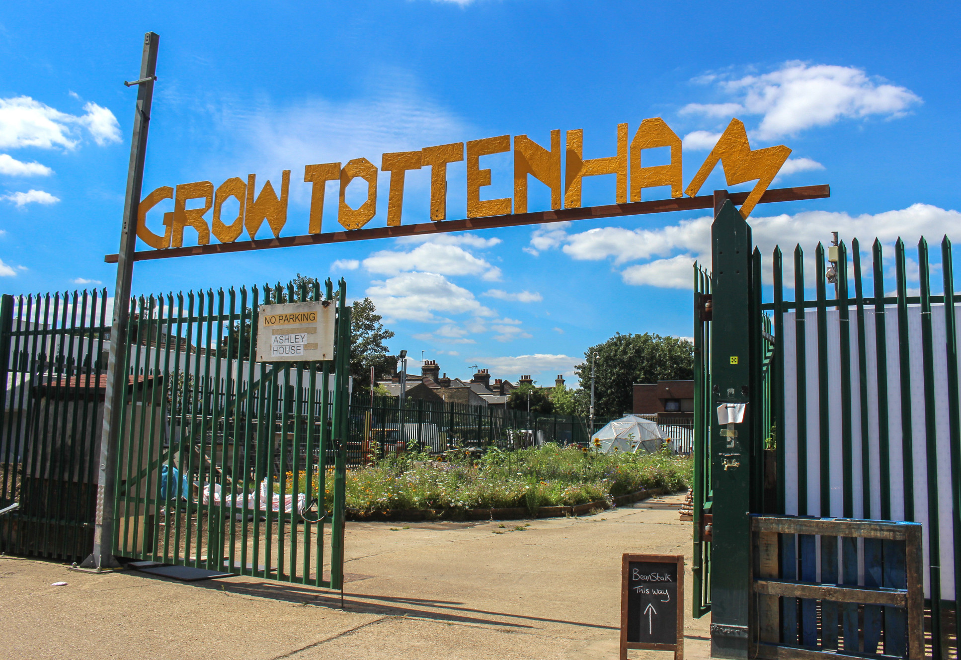 Sign over a fence that read 'Grow Tottenham'