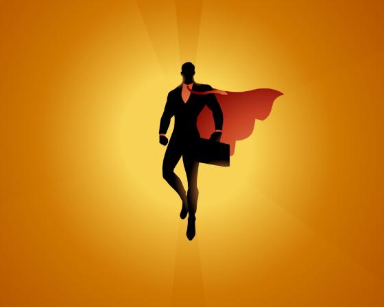 A silhouette style vector illustration of a superhero businessman levitating mid-air with waving cape and sun in the background