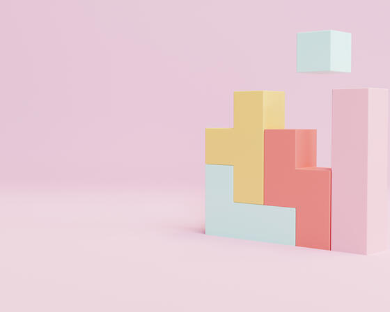 A 3D illustration of pastel-coloured blocks stacked on a pink background, with one block floating above the others