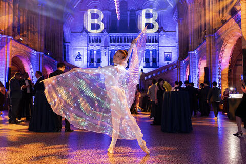 Ballet performers, with LED fairy wings dance at Natural History Museum Party 2024