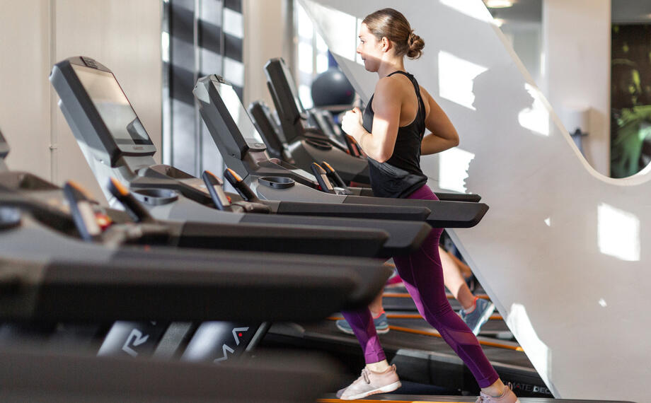 Female running on treadmill in ethos gym