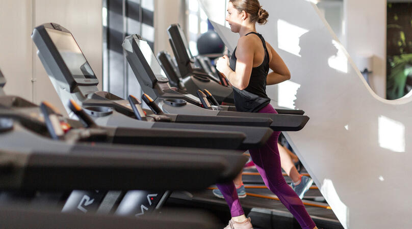 Female running on treadmill in ethos gym