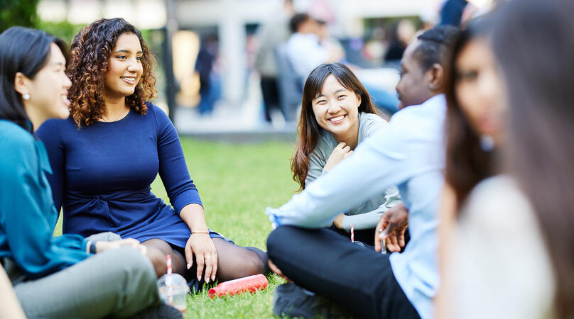 Students chatting on the grass