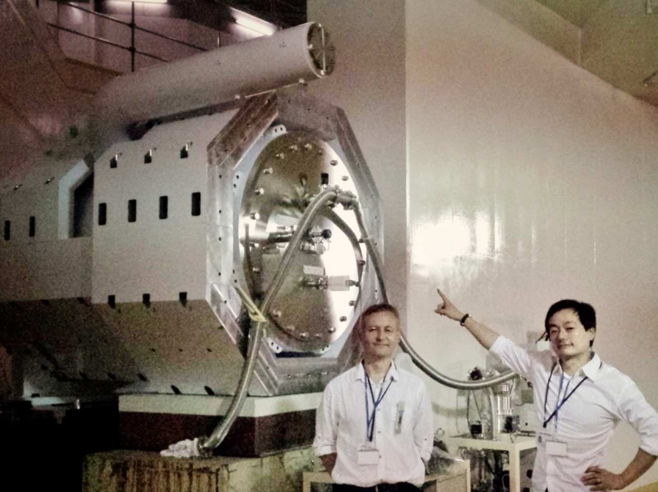 Comet solenoidal superconducting magnet. Dr Per Jonsson (left) and Prof Yoshi Uchida (right).