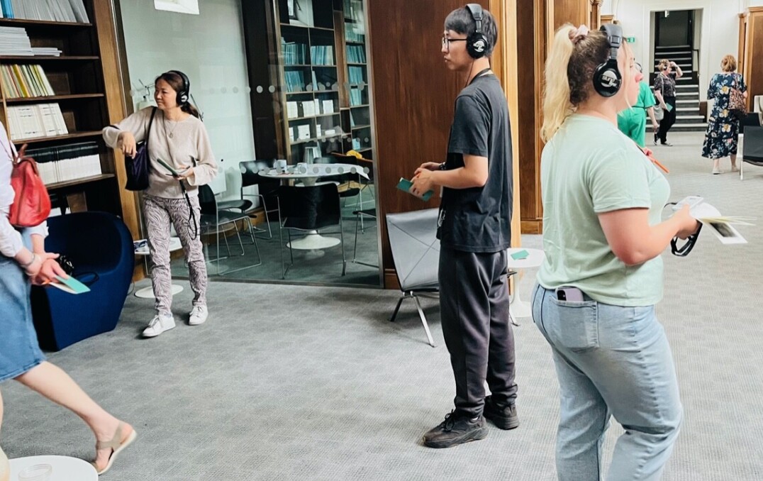 People in library with headphones