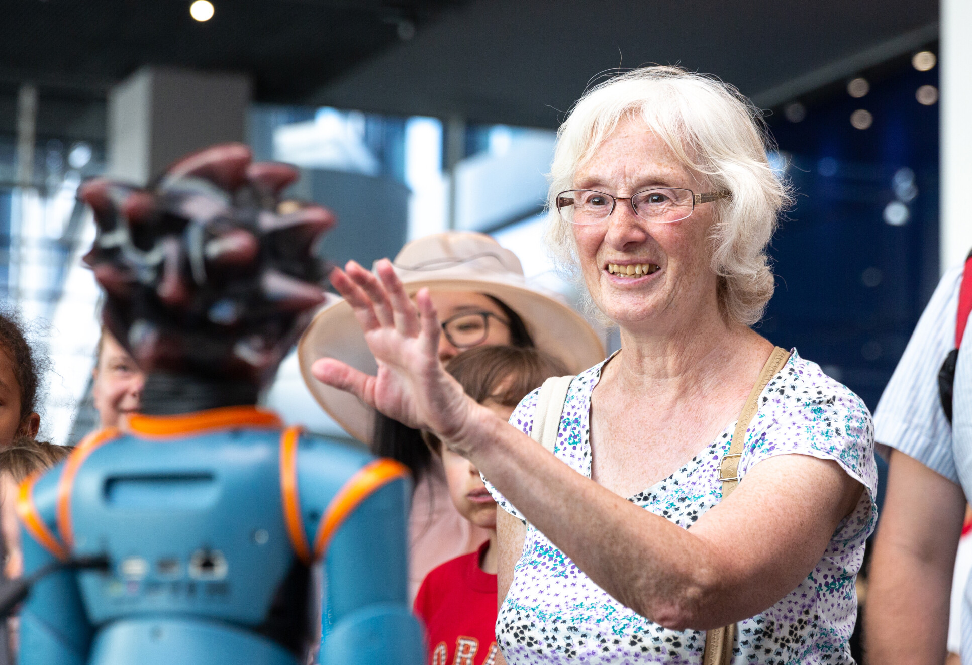 An older woman at a science stall at the festival