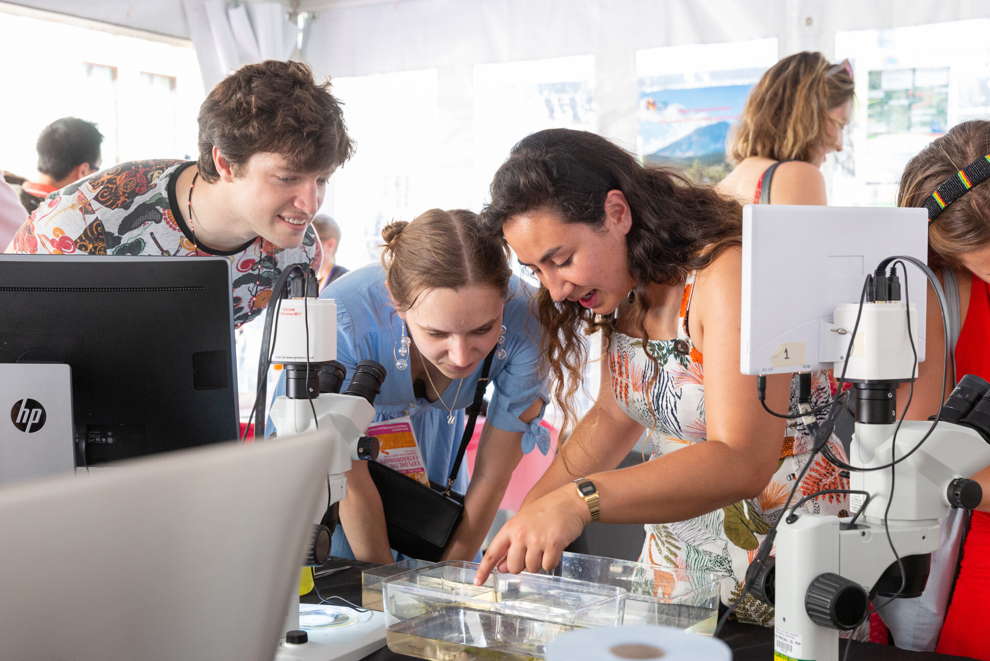 Young people at an interactive biology exhibit