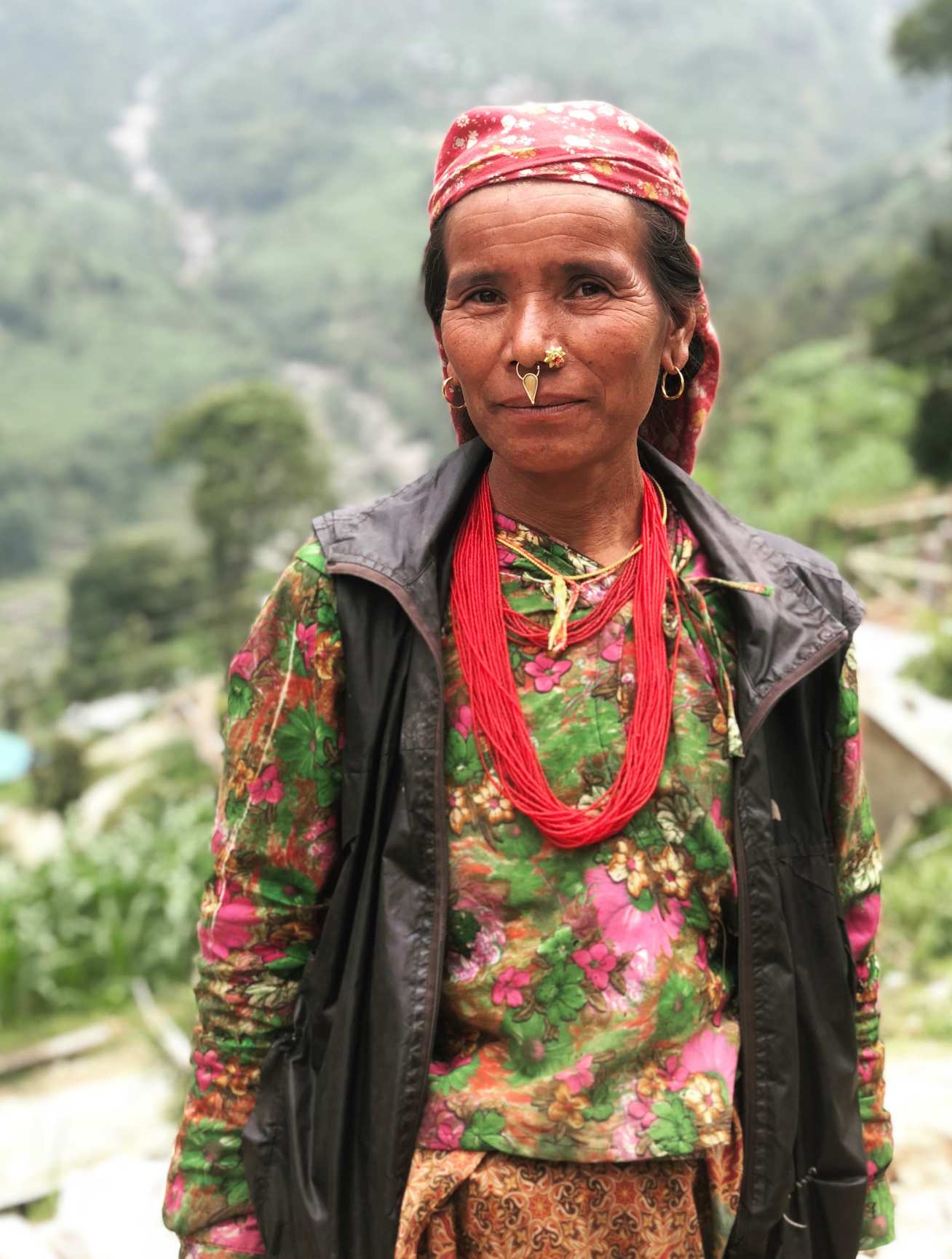 A Nepalese lady in front of landscape