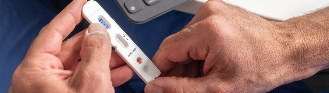 A person holding an antibody testing kit