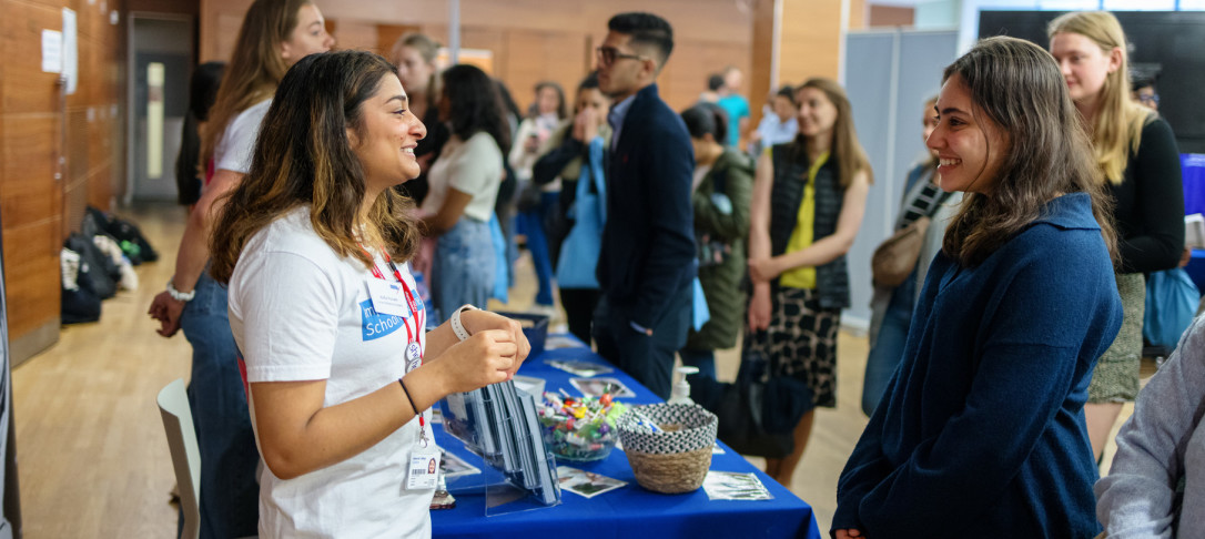 Bioengineering students speaking to an attendee at an Open Day event