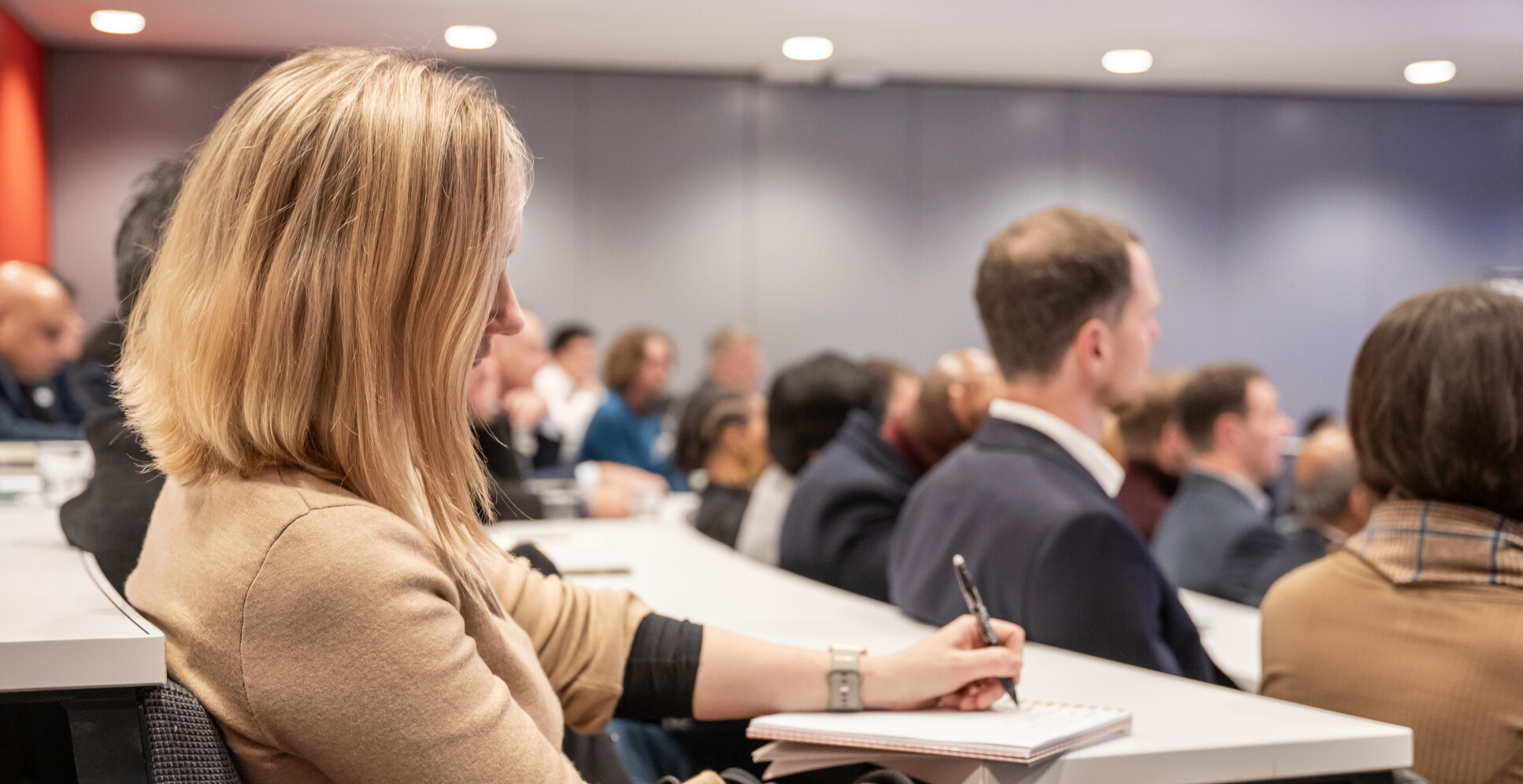 Alumna taking notes during the panel session