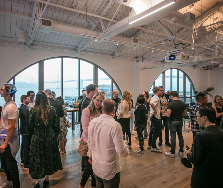 Networking at a previous event in San Francisco at a venue with lots of natural light