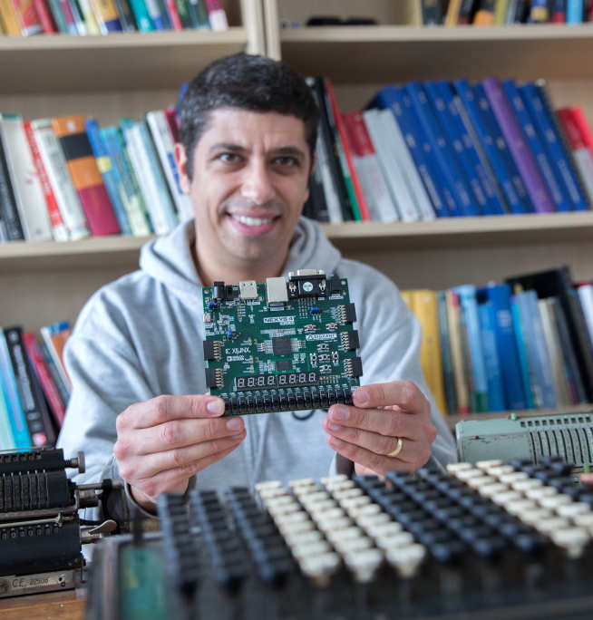 Professor George Constantinides holding computer chip