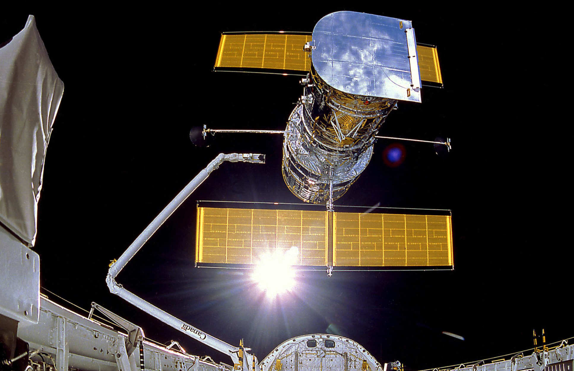 The deployment of the Hubble Space Telescope in April 1990