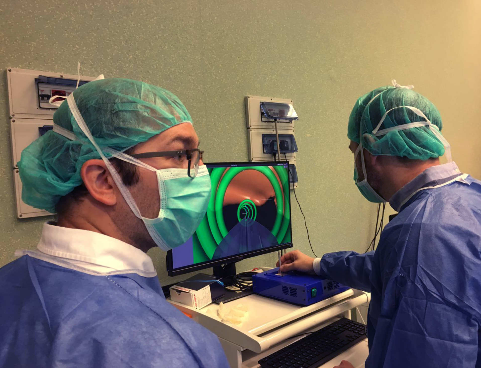 Dr Riva and Dr Secoli oversee the intraoperative interface of the catheter