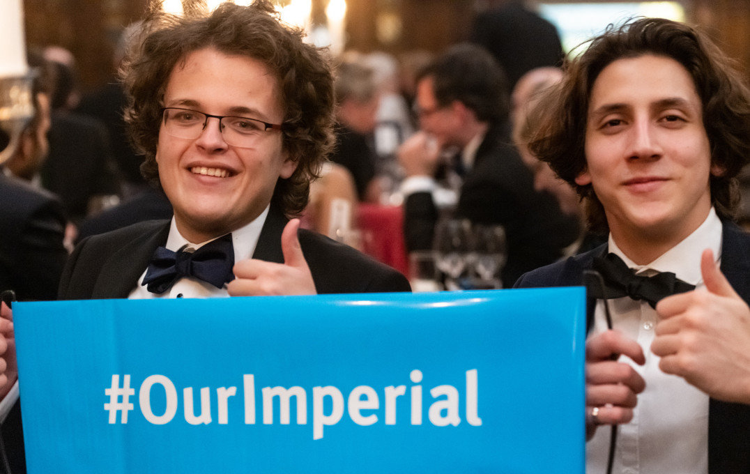 Alumni holding a #OurImperial sign 