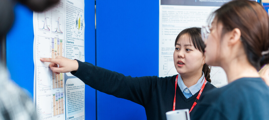 Person pointing at a board