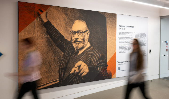 Image of Professor Abdus Salam outside the Assistive Technology Room on level 1 at the Abdus Salam Library