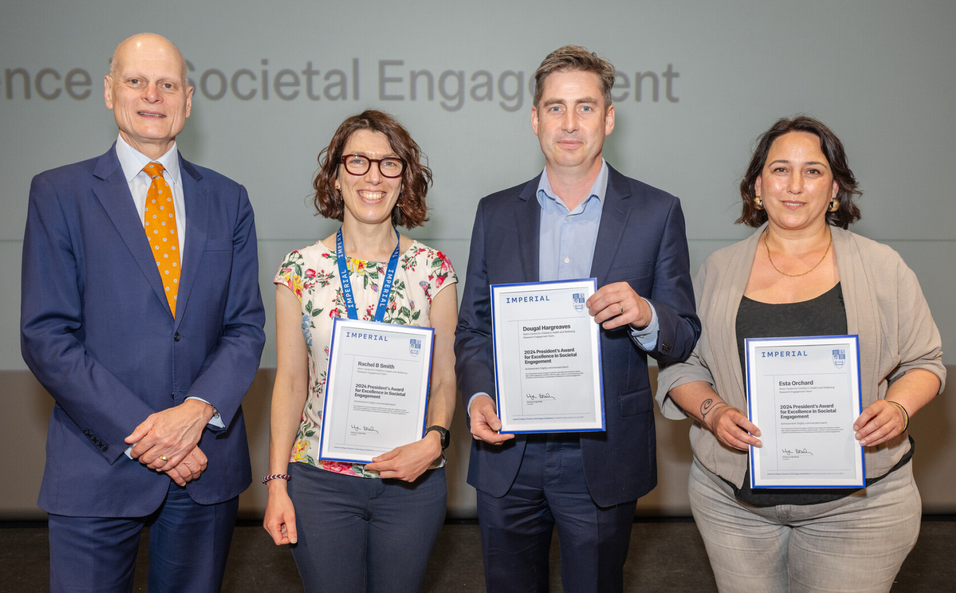 The Mohn Centre Research Engagement team receiving their award from Provost Ian Warmsley