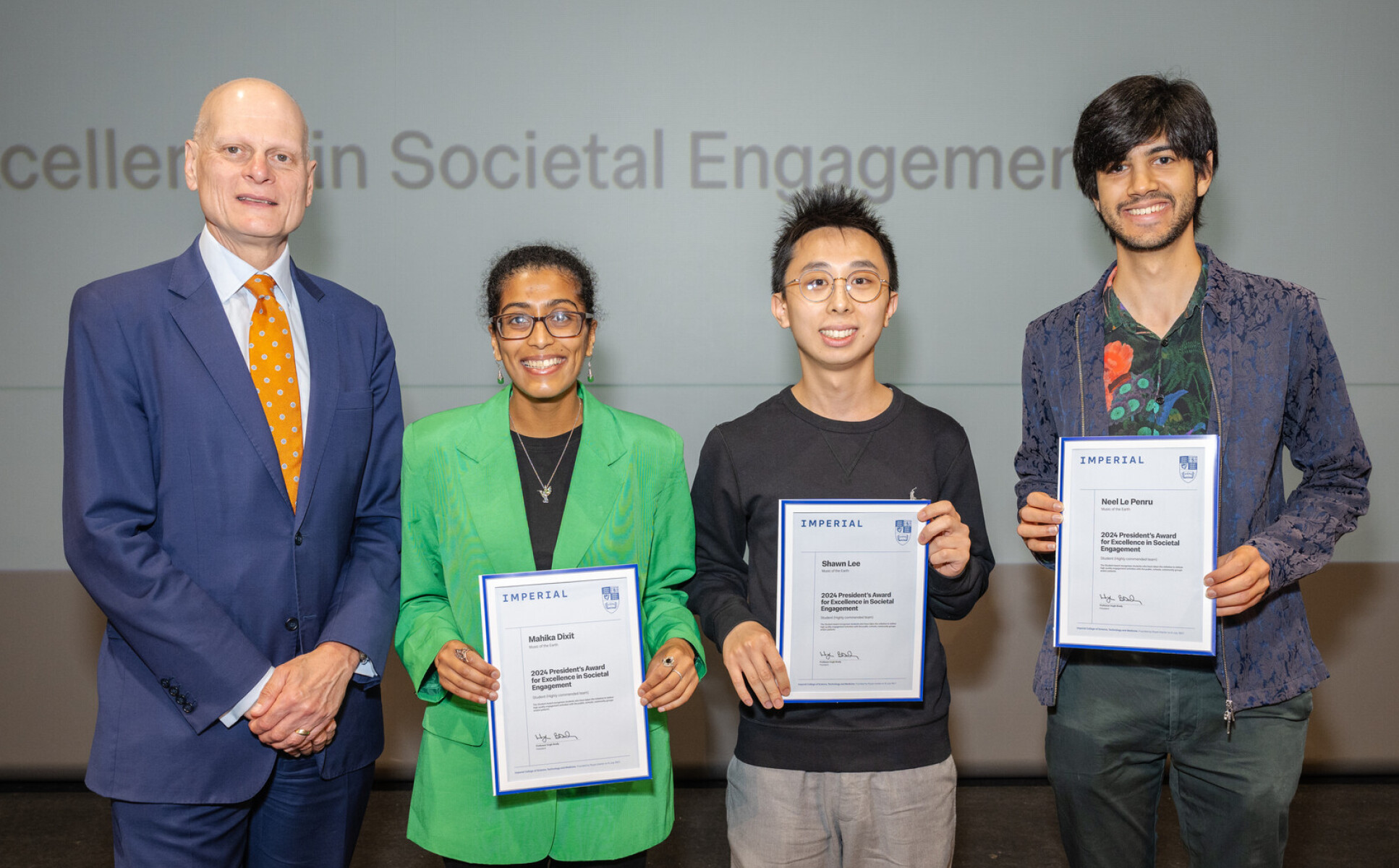 Music of the Earth (Shawn Lee second from the right) receiving their award from Provost Ian Warmsley