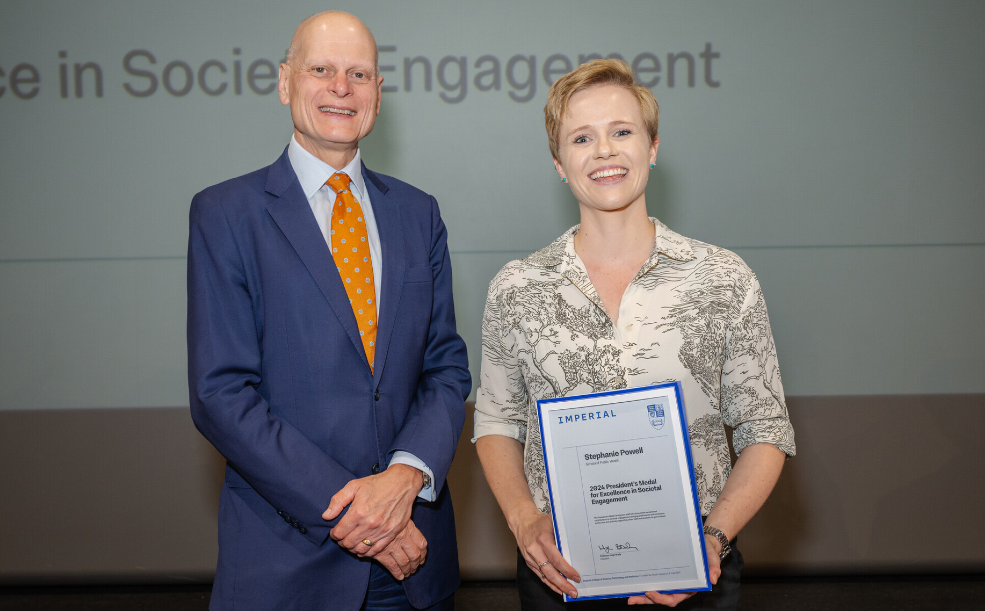 Stephanie Powell receiving her award from Provost Ian Warmsley