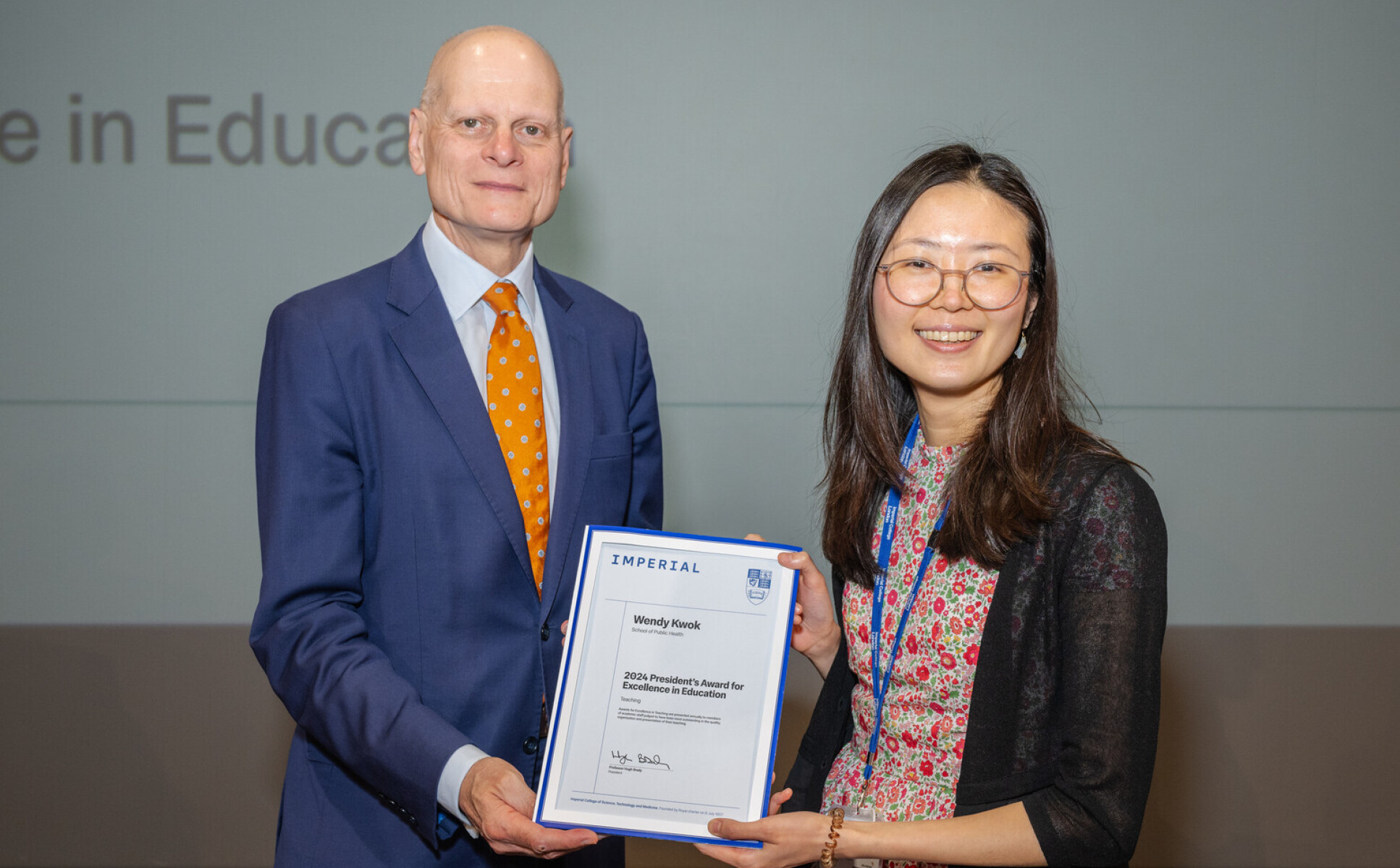 Wendy Kwok receiving her award from Provost Ian Warmsley