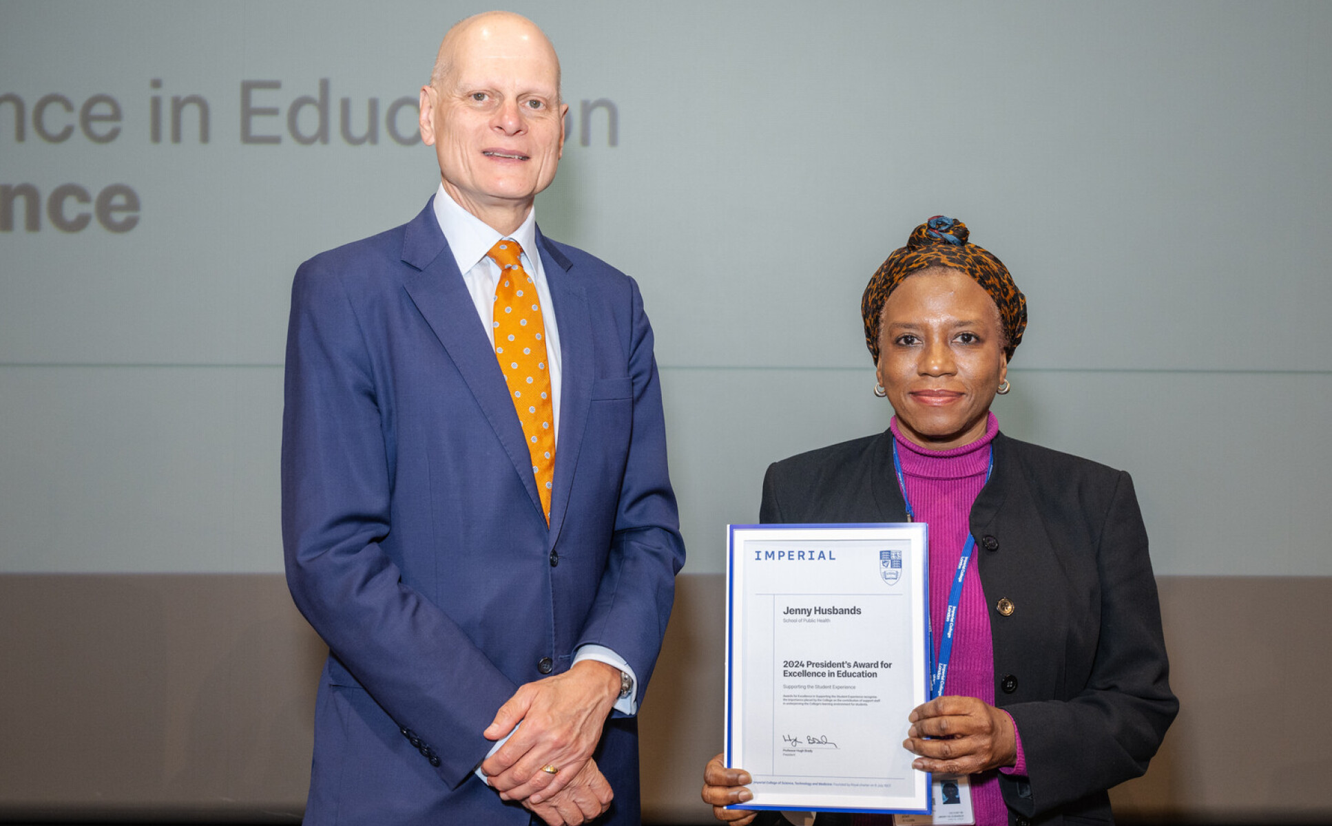 Jenny Husbands receiving her award from Provost Ian Warmsley