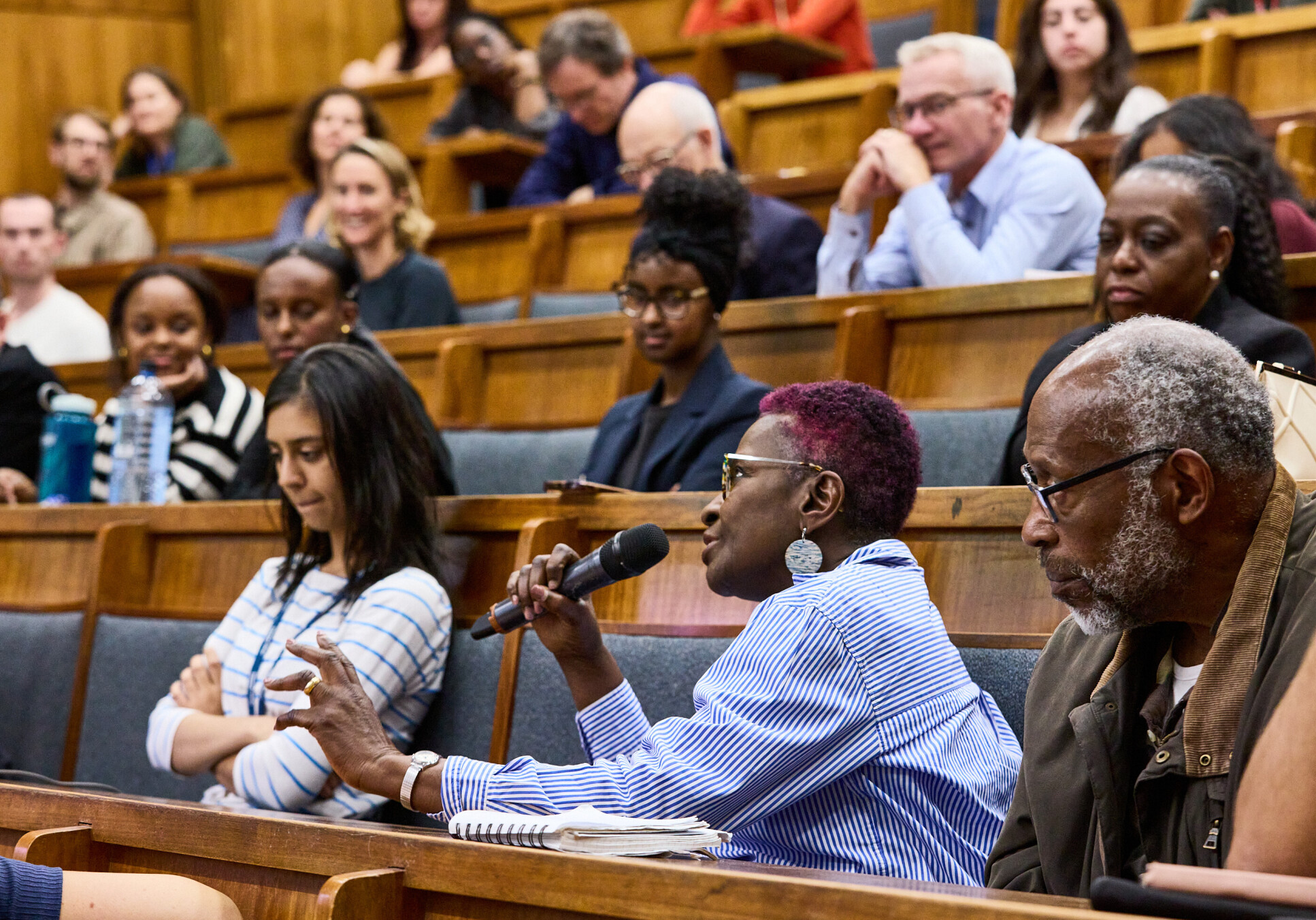 A person in an audience asks a question 