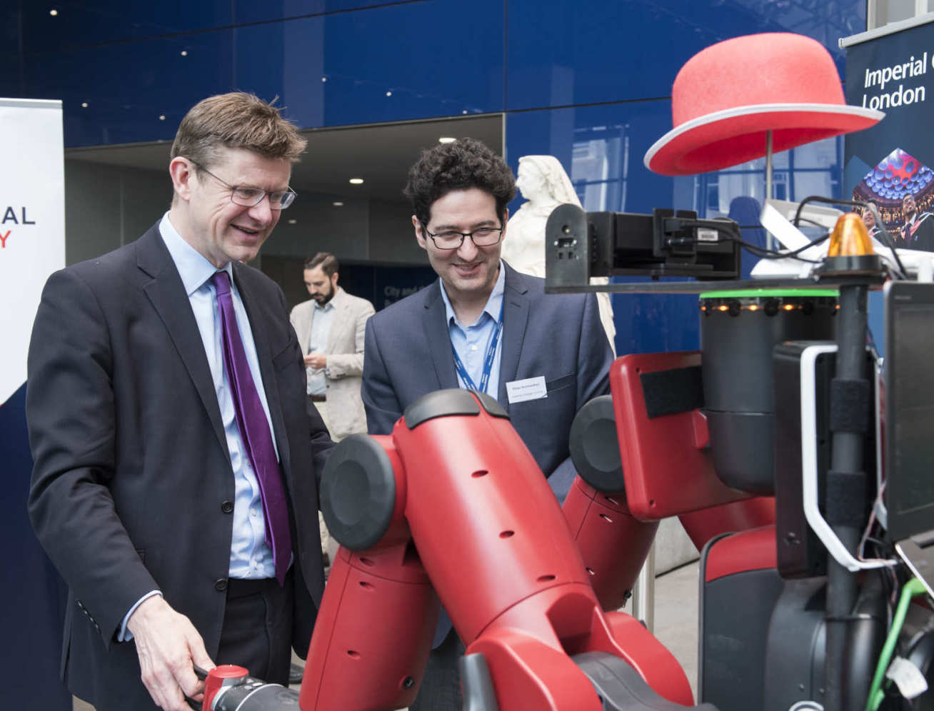 Business Secretary Greg Clark interacting with robot named Robot DE NIRO at Imperial.