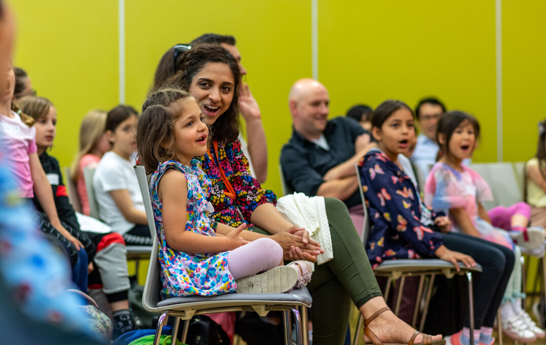 A smiling audience of children