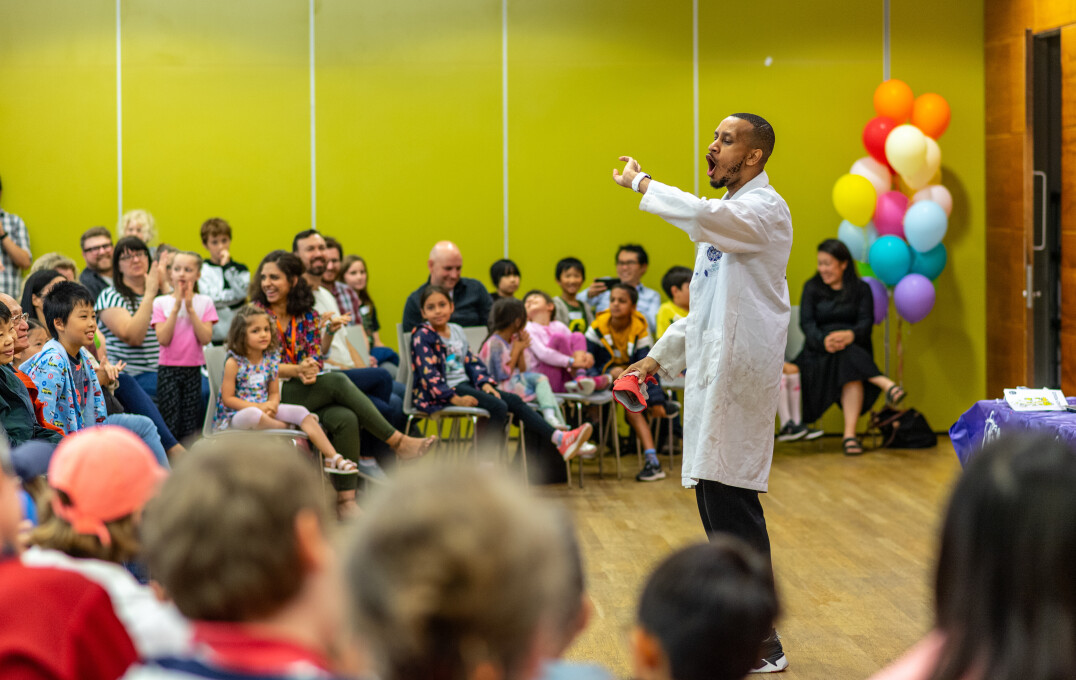 A scientist demonstrating an experiment to a captive audience