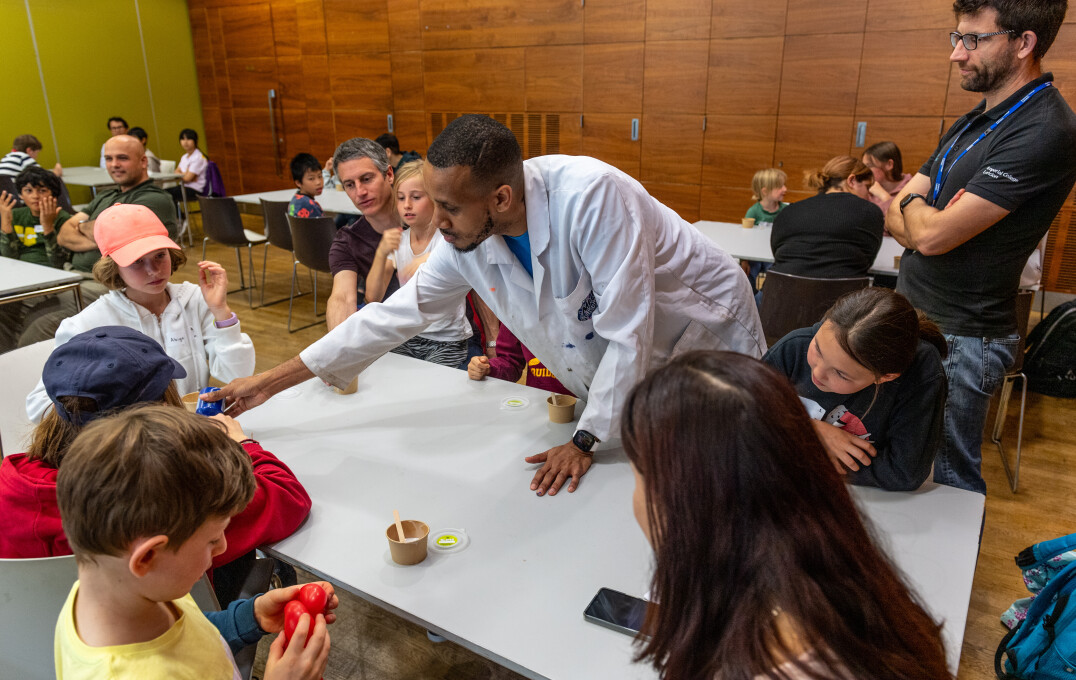 A group of children being shown how to make slime