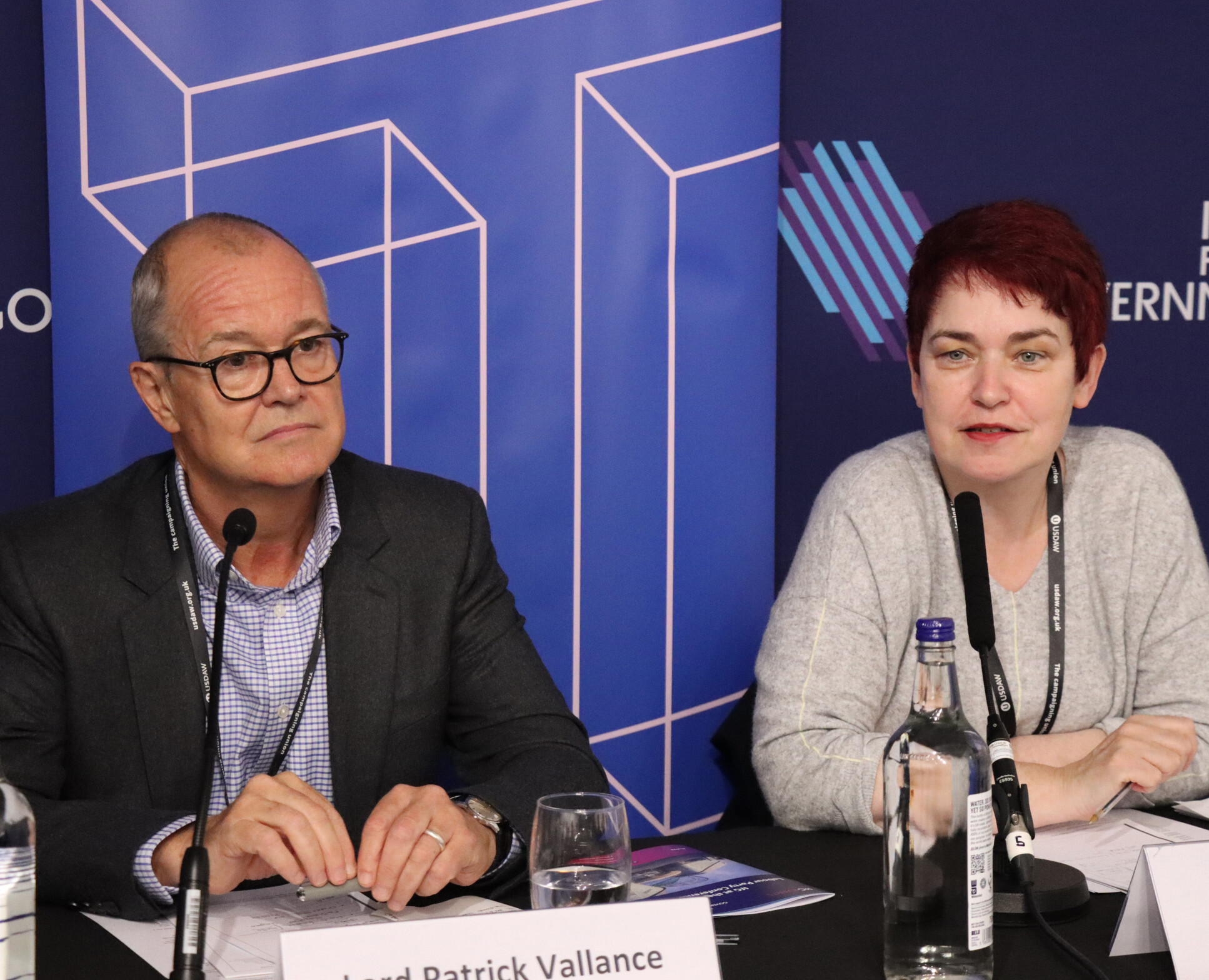 Minister for Science, Research and Innovation Sir Patrick Vallance sitting beside Professor Mary Ryan, who is speaking