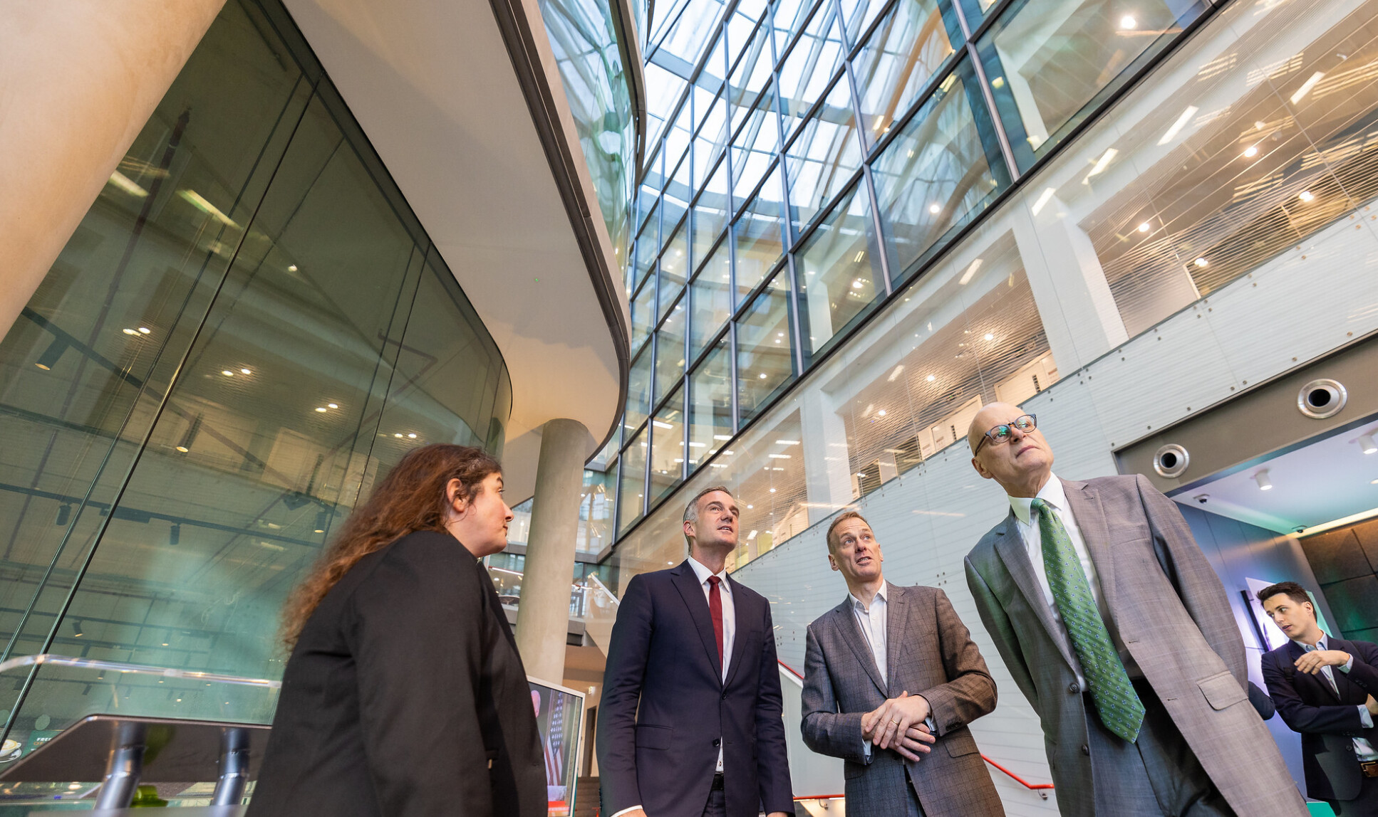 Professor Polizzi, Dr Kyle, Professor Bull and Professor Walmsley in the reception area of the I-HUB building looking up at the spaceI-HUB