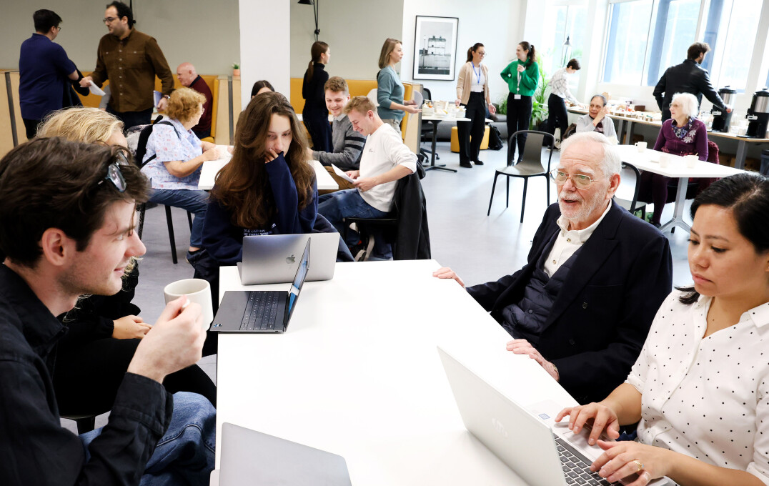 Workshop participants sitting down, discussing