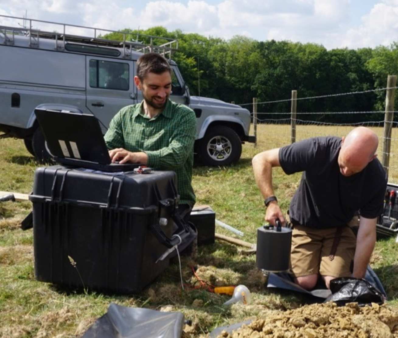 Photo of Dr Stephen Hicks installing seismometers in a fiend