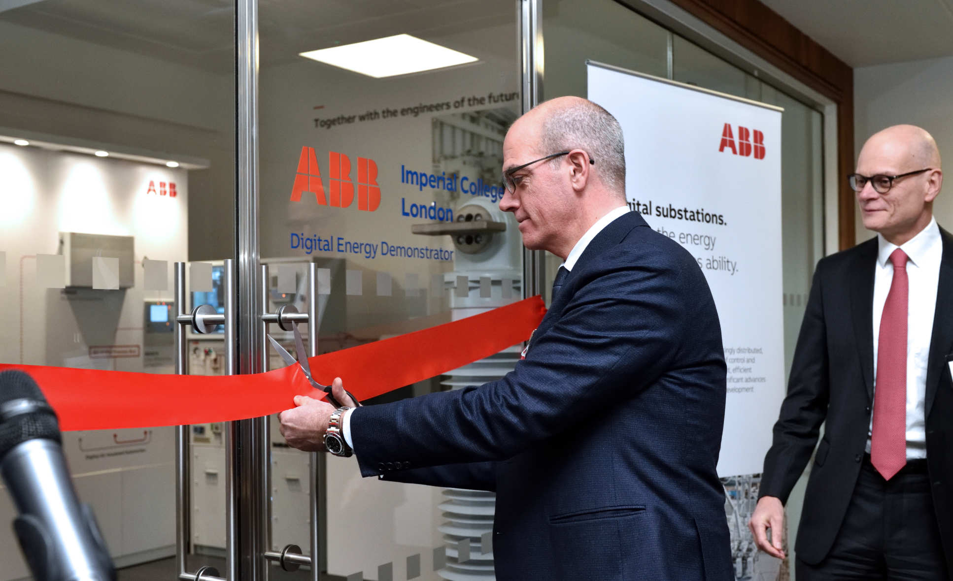 Claudioa facchin cutting the ribbon at the opening event for the ABB-Imperial Smart Energy Demonstrator