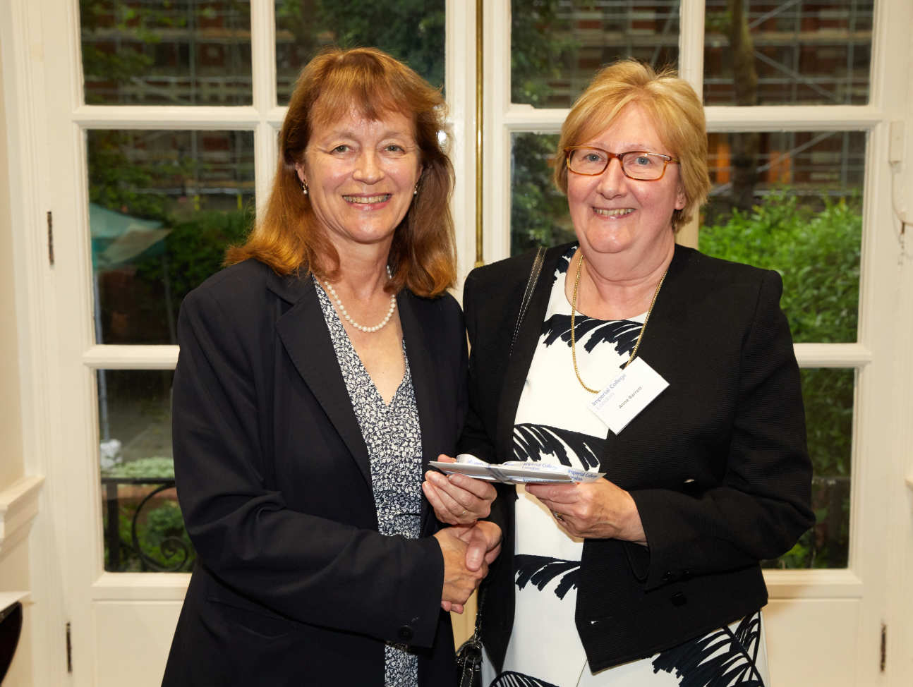 Anne Barrett receives her prize from President Alice Gast