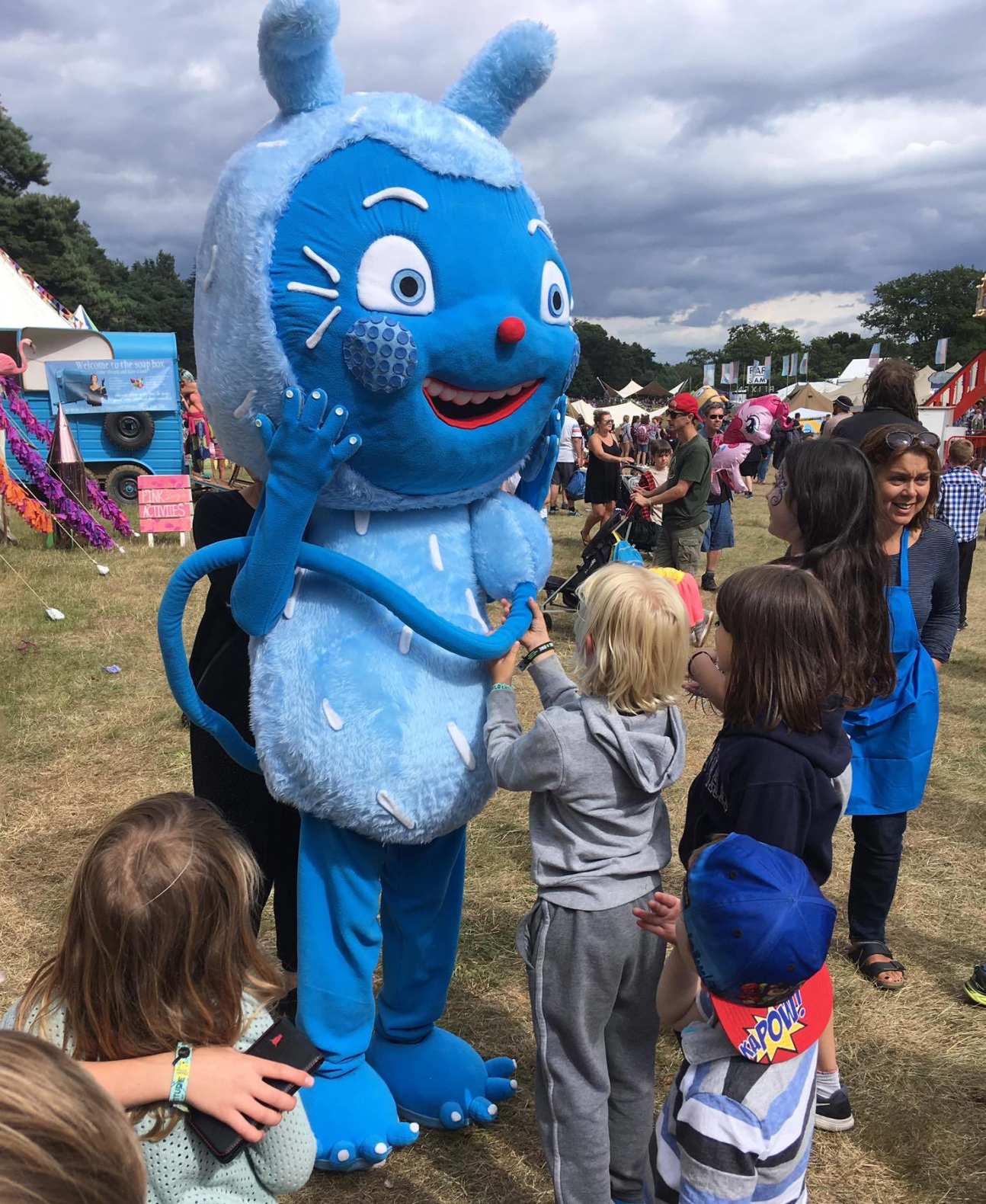 Messy Monster mascot interacting with children