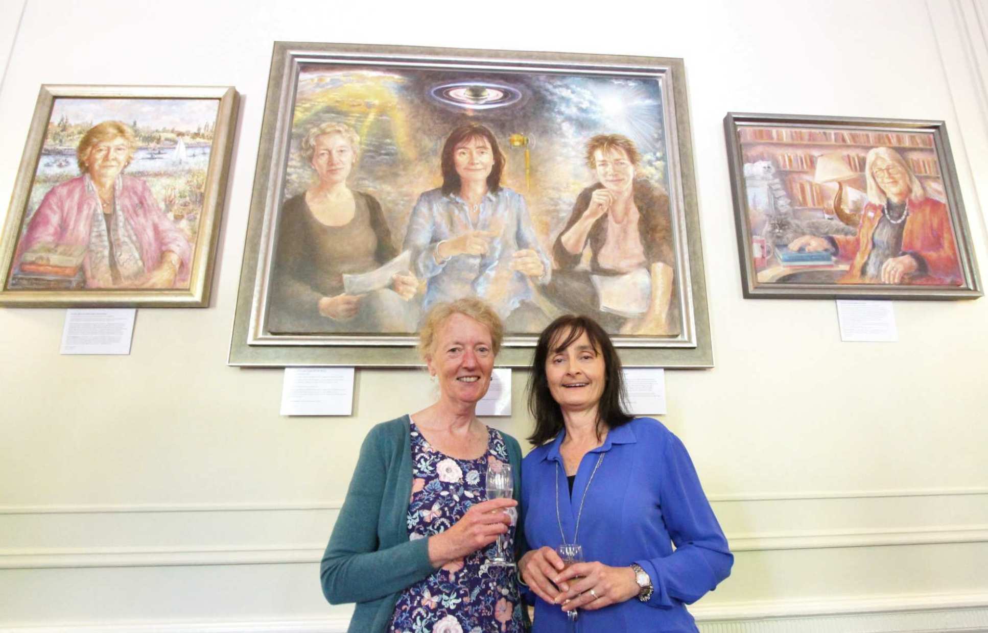 Professor Joanna Haigh (left) and Professor Michele Dougherty (right) in front of their new portrait
