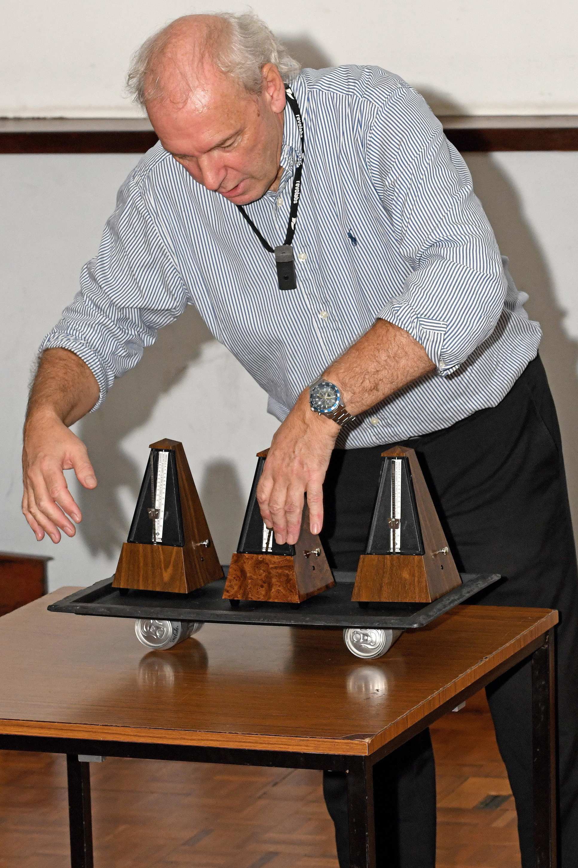 Professor Ken MacLeod uses metronomes to illustrate the re-synchronisation of heart cell rhythms during his inaugural lecture