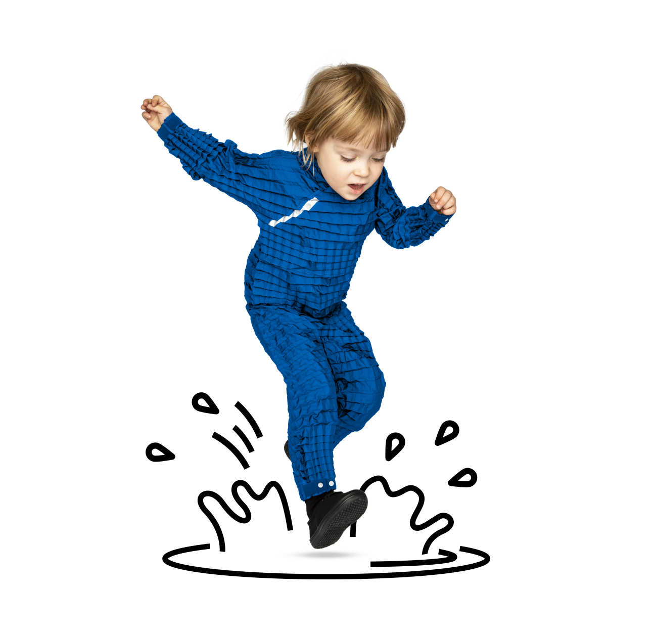 A child jumping in a puddle
