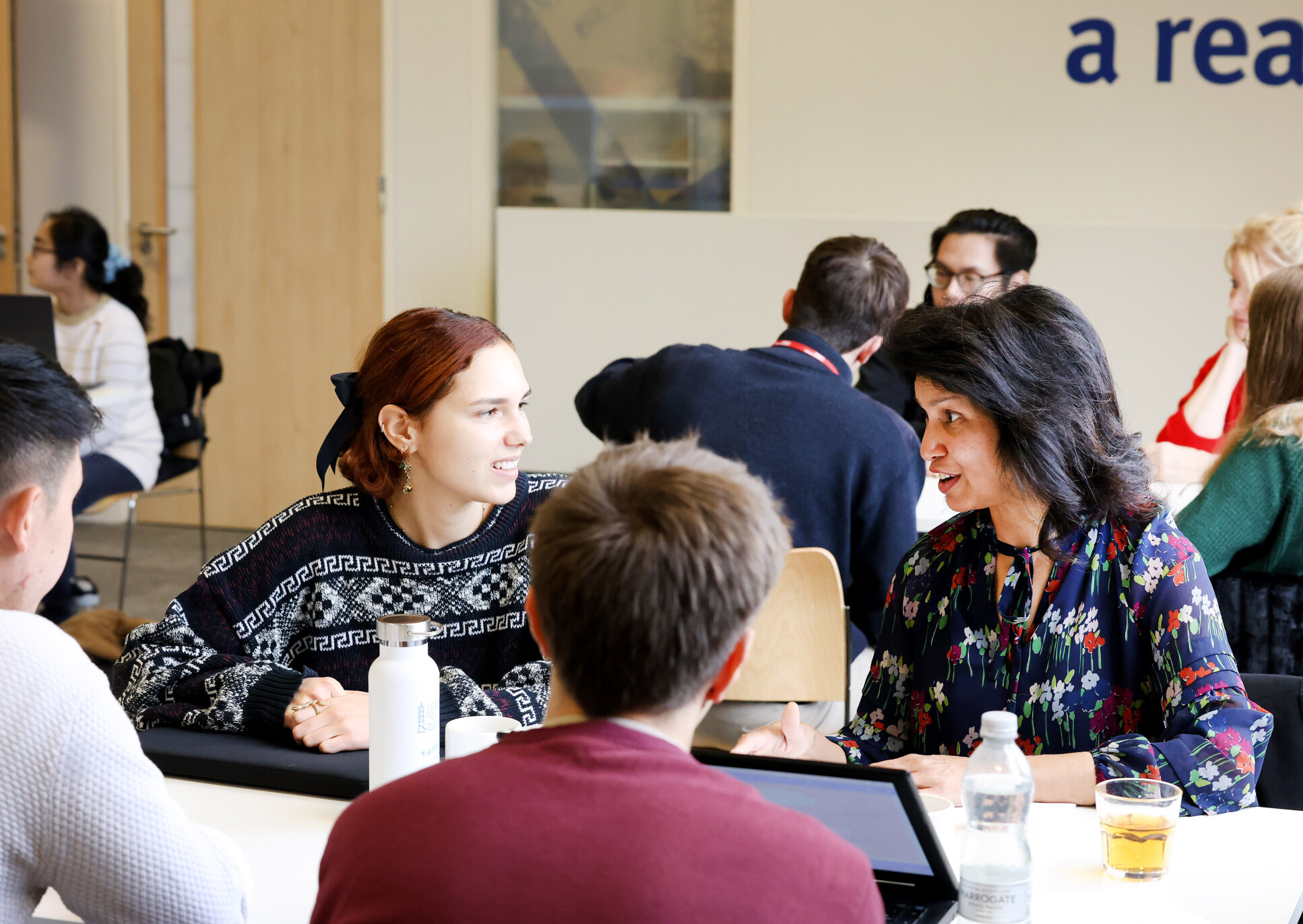 students and patients discussing research