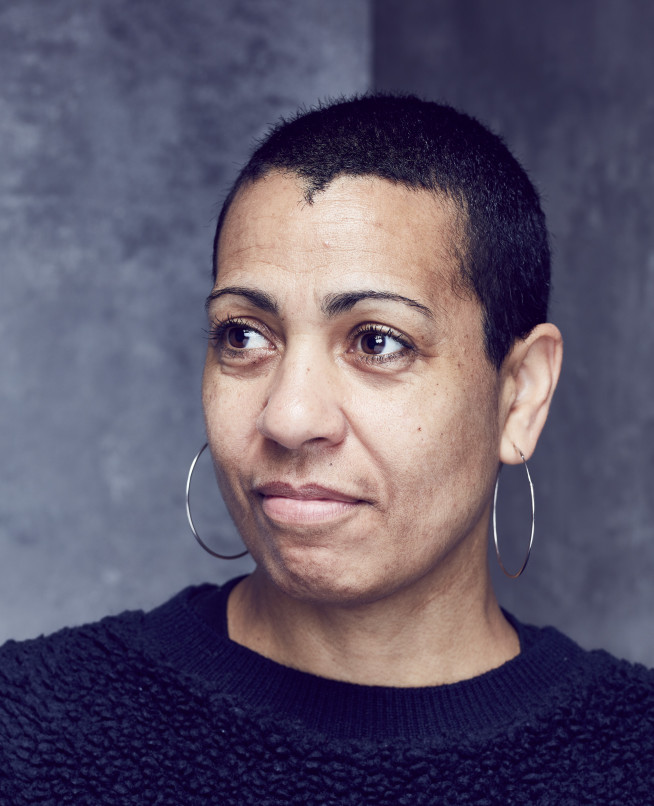 Photo is a portrait of the artist Helen Cammock, a Black woman in her middle age with short natural hair