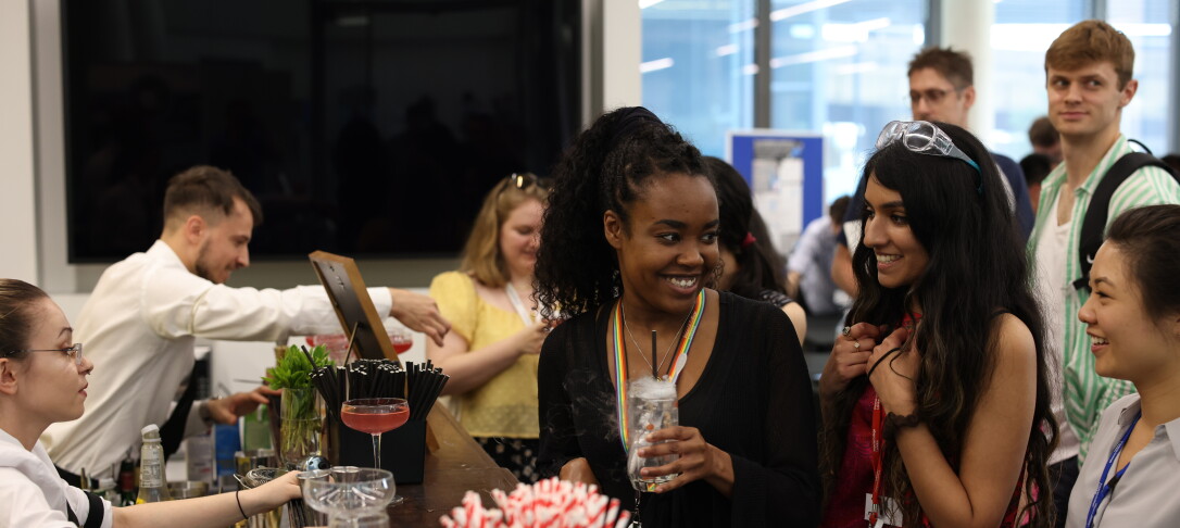 students smiling with drinks