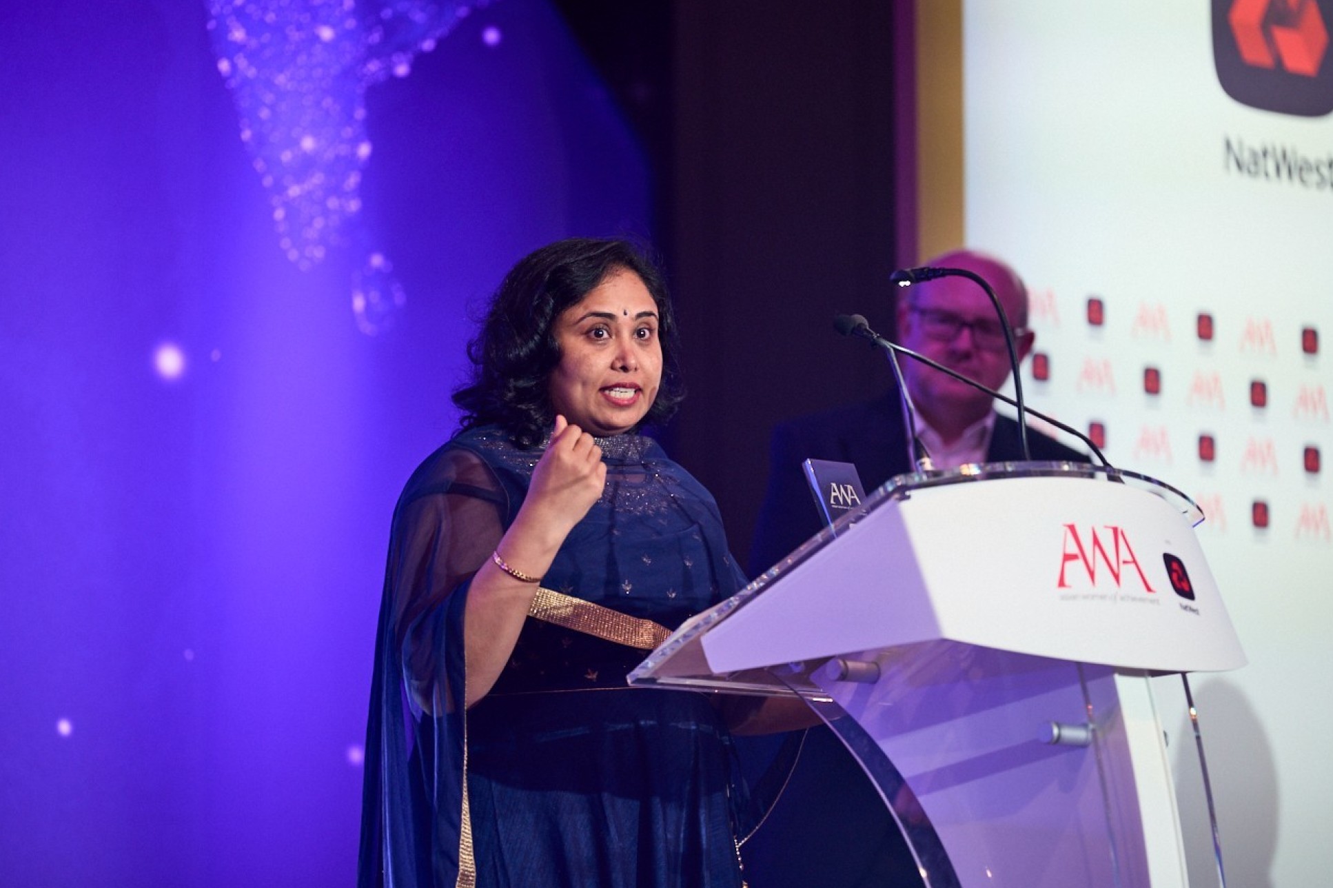 Dr Pavani Cherukupally accepts her prize at the Asian Women of Achievement Awards 2022.