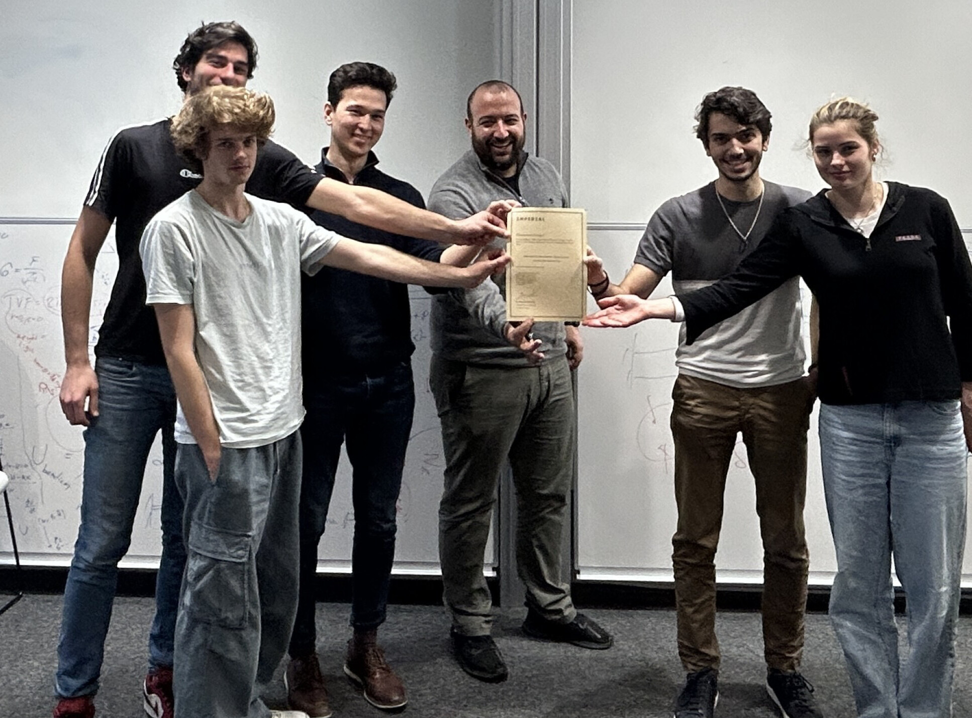 Dr Dimitrios Chantzis presents the ‘Award for Best Business Case’ to MPT Coursework Group 2